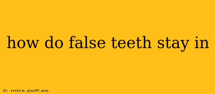 how do false teeth stay in